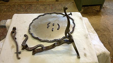 Repair of mirror, broken and water-damaged in house fire.